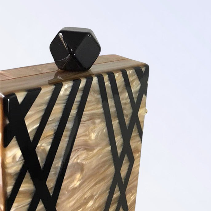 Clutch acrílico de rayas irregulares