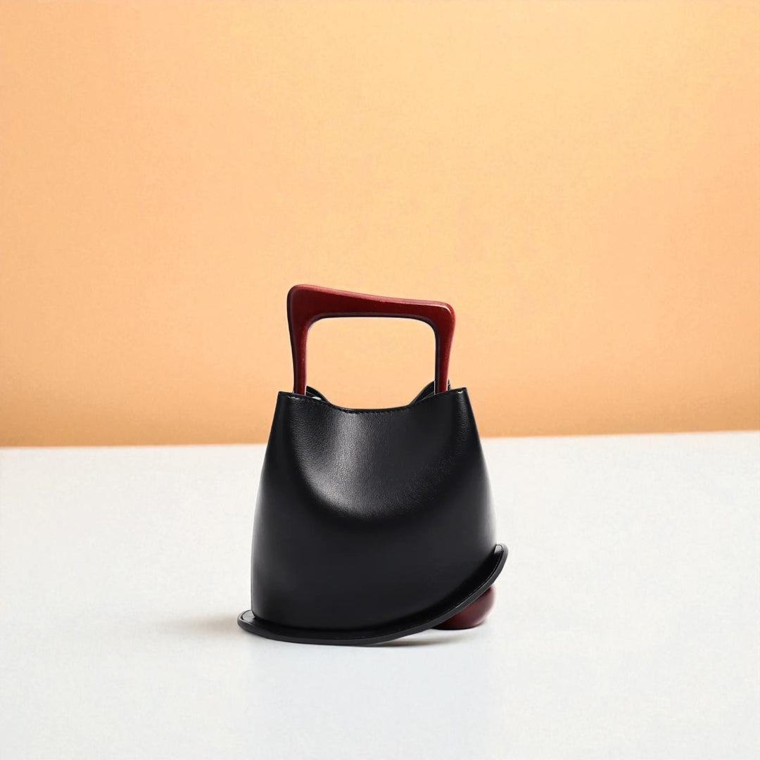 Bolso tipo cubo de piel de vacuno para mujer